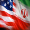 Close-up of a waving American flag blended with the Iranian flag, showing stars and red stripes.