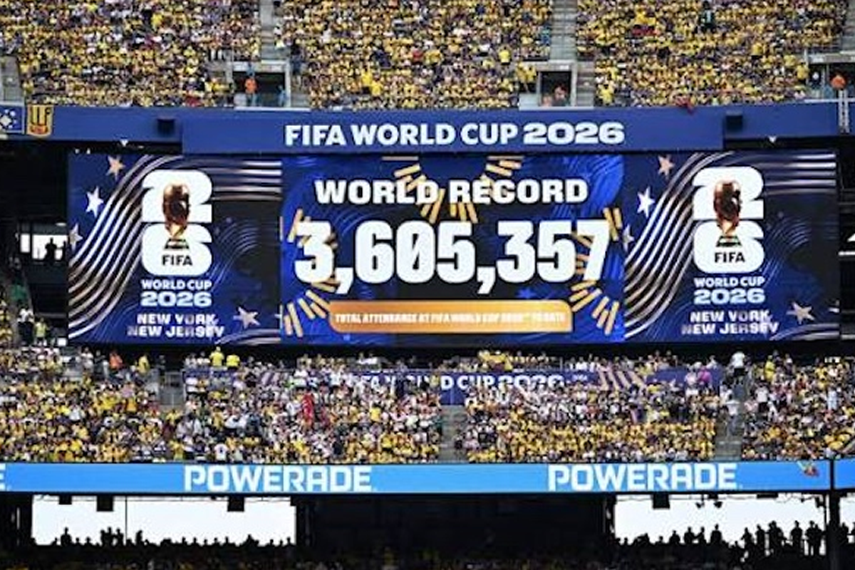 Large stadium scoreboard announcing FIFA World Cup 2026 with world record attendance 3,605,357 and cheering yellow-clad fans in New York/New Jerseye