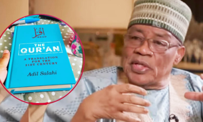 Man in a traditional cap and glasses speaks, with a turquoise copy of The Qur'an (translation for the 21st century) visible in a circular inset labeled by Adil Salahi.