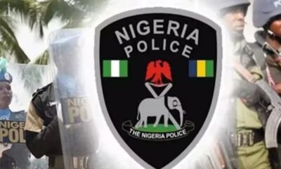 Nigeria Police emblem on a shield with officers in the background, conveying law enforcement.