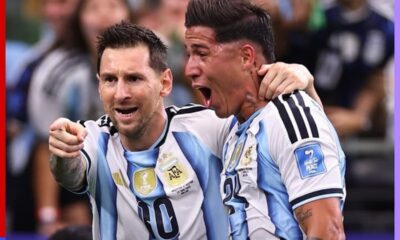 Two Argentine national team players celebrate together, arms around each other, in light-blue and white striped jerseys.