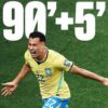 Brazilian soccer player in a yellow jersey celebrates on a green pitch as the overlay shows 90+5'.