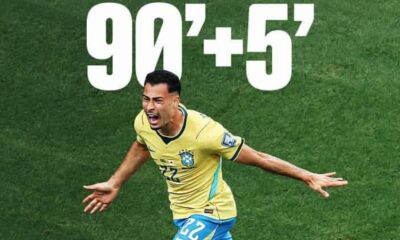 Brazilian soccer player in a yellow jersey celebrates on a green pitch as the overlay shows 90+5'.