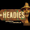 Gold ornate logo reading 'THE HEADIES' with 'AFRICA TO THE WORLD,' featuring a carved gold mask on the right and colorful decorative border on a black background.