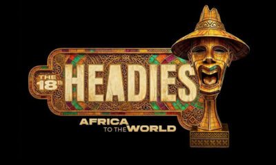 Gold ornate logo reading 'THE HEADIES' with 'AFRICA TO THE WORLD,' featuring a carved gold mask on the right and colorful decorative border on a black background.