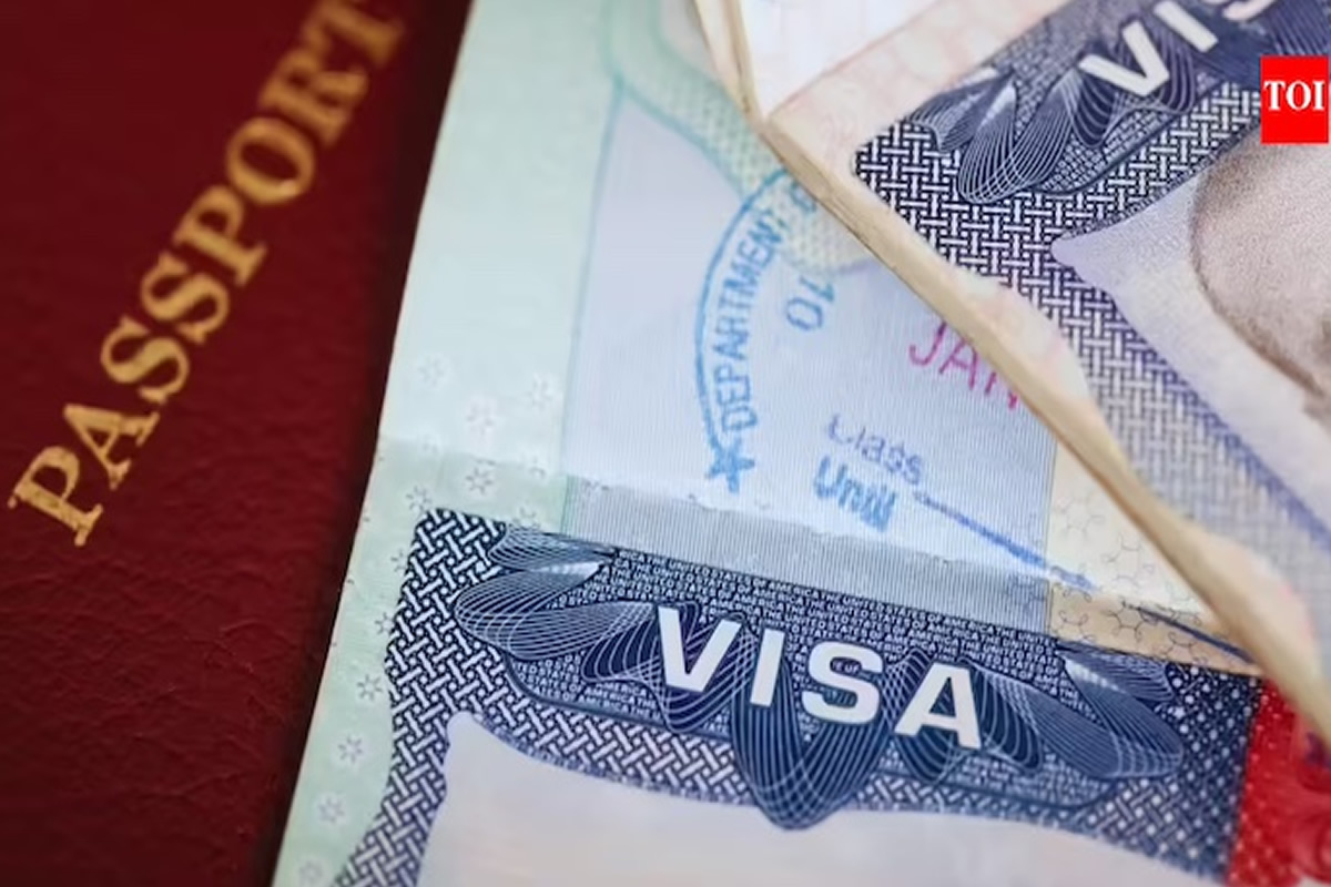 Close-up of a red passport cover beside a stack of currency notes and a Visa card partially visible (informative image: travel documents and money).