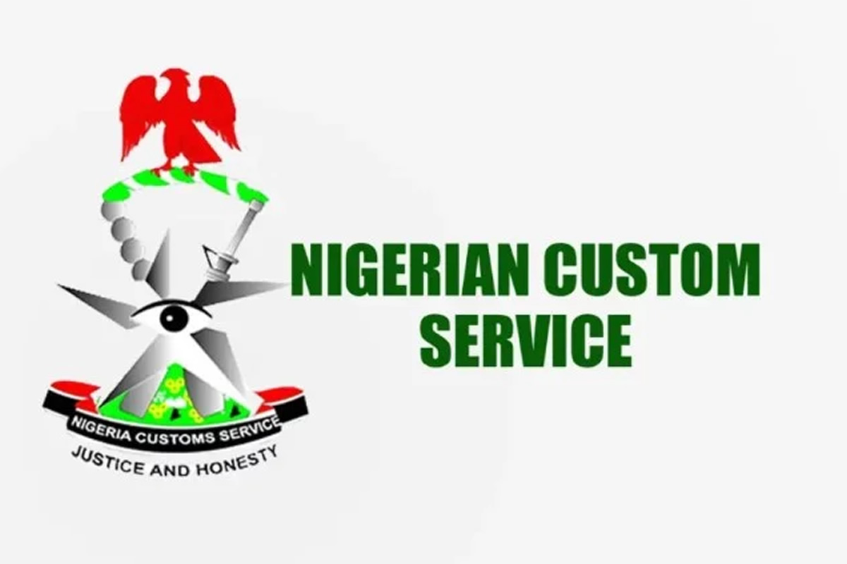 Logo for Nigerian Custom Service featuring a red eagle atop a green/white emblem, with the bold green title 'NIGERIAN CUSTOM SERVICE' and the motto 'JUSTICE AND HONESTY' beneath.