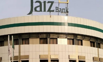 Jaiz Bank signage atop a modern beige building with a green stripe