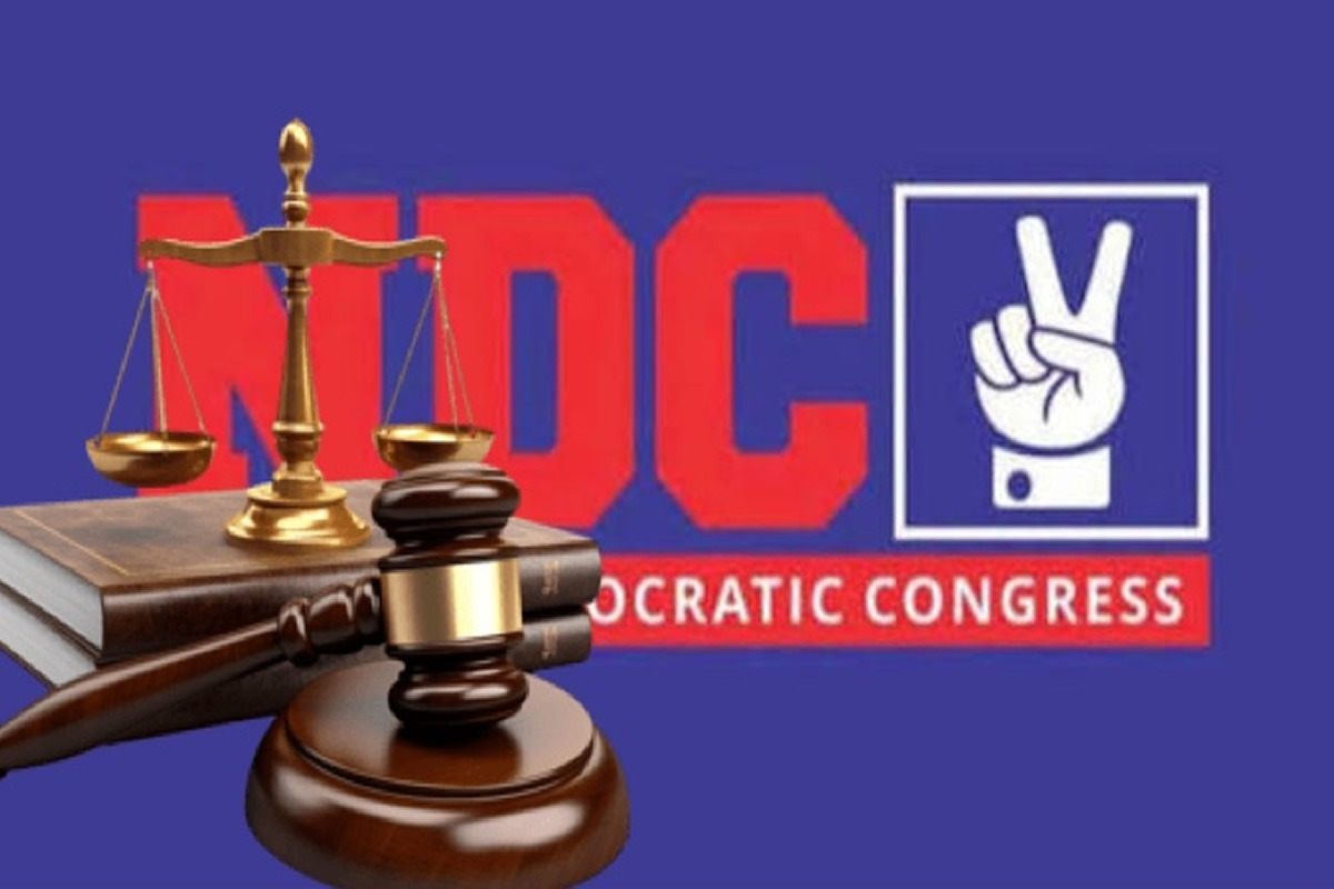 Scales of justice and judge's gavel in front of a red 'DC' logo and 'Democratic Congress' text on a blue background.