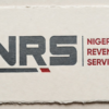 NRS logo: large dark gray letters 'NRS' with a small red diagonal accent, and 'NIGERIA REVENUE SERVICE' in red to the right