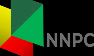 Logo with multicolor geometric shapes to the left of the gray 'NNPC' lettering on a black background.
