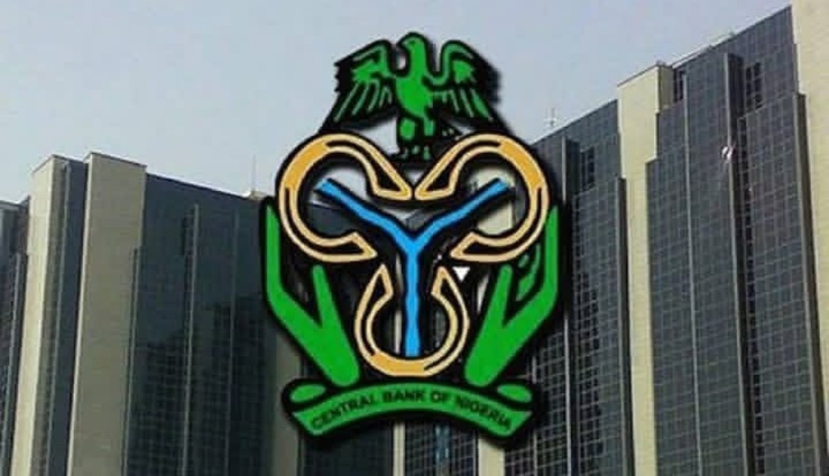 Facade of a tall bank building with the Central Bank of Nigeria logo prominently displayed