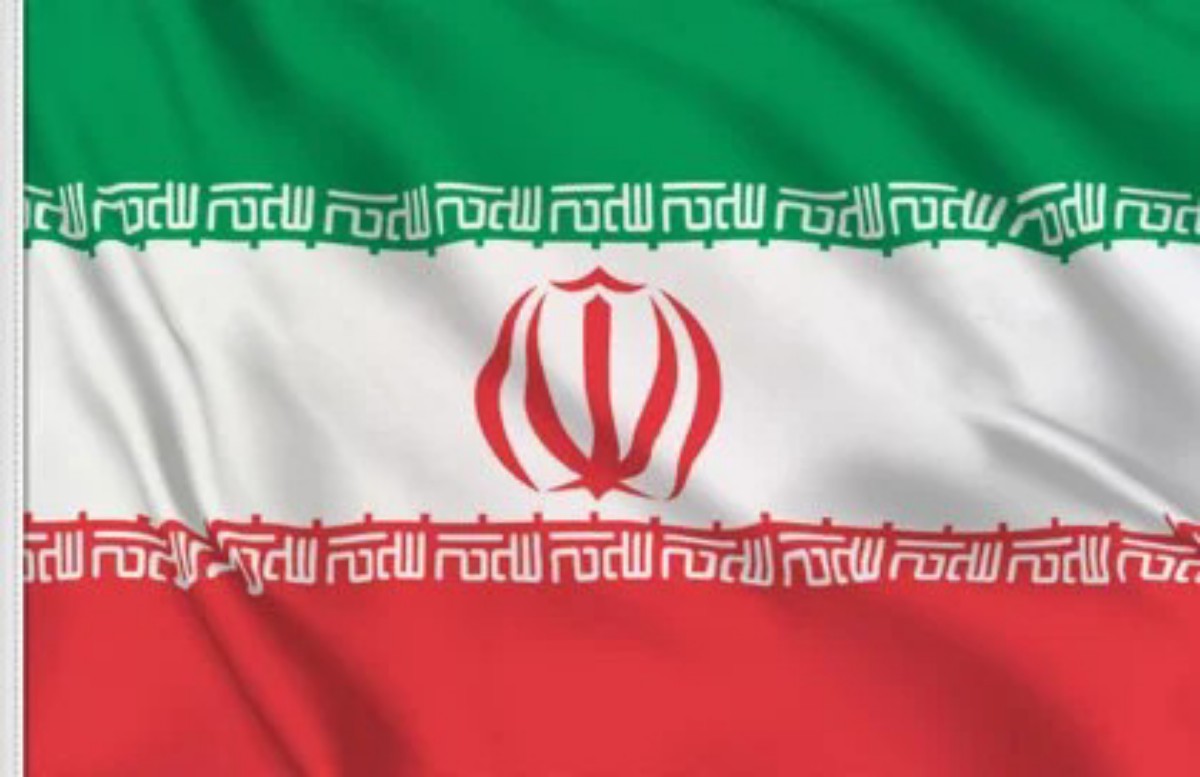 Iran national flag showing green, white, and red stripes with a red emblem in the center and Kufic script along the borders.