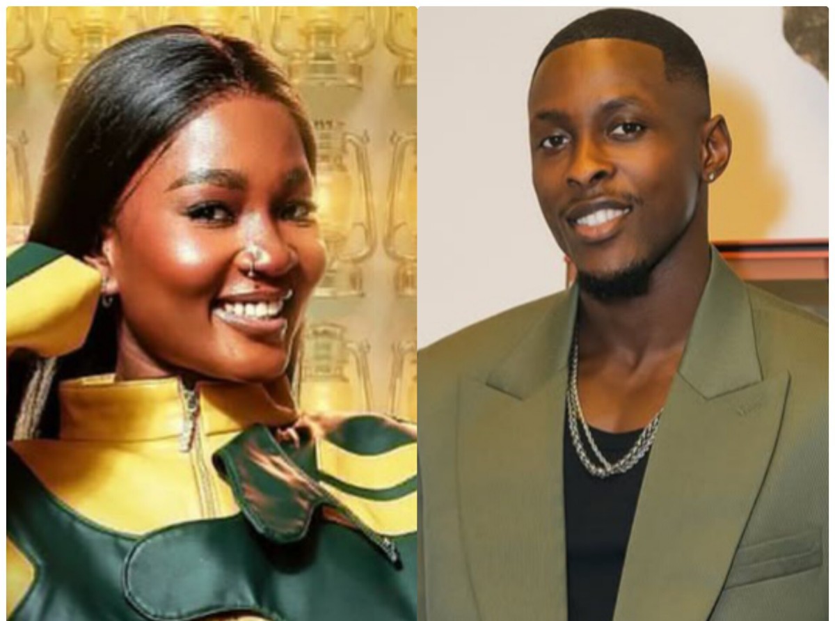 Two people posing for a photo: a smiling woman in a green-yellow jacket on the left and a smiling man in an olive blazer with a chain on the right.