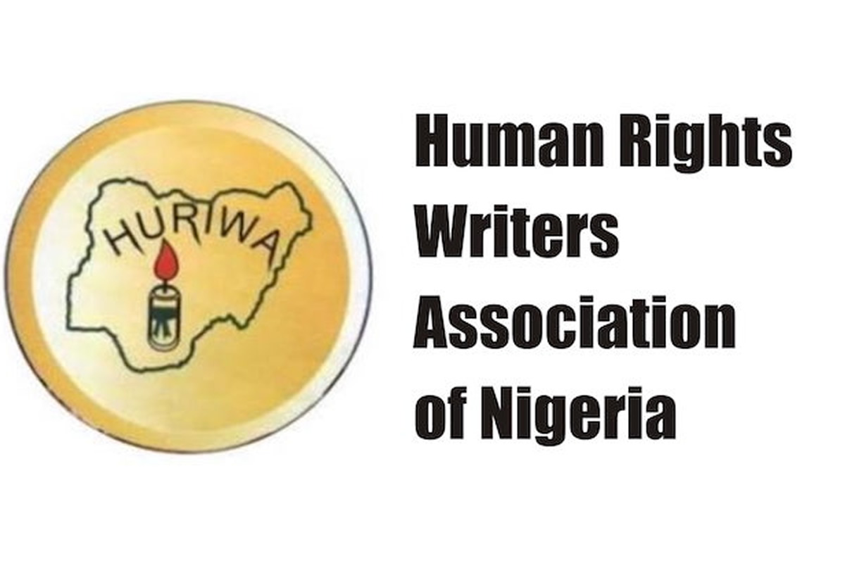 Logo for Human Rights Writers Association of Nigeria, showing Nigeria outline with a candle inside a yellow circle.