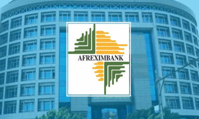Afreximbank logo with green and orange geometric emblem on a blue office building background.