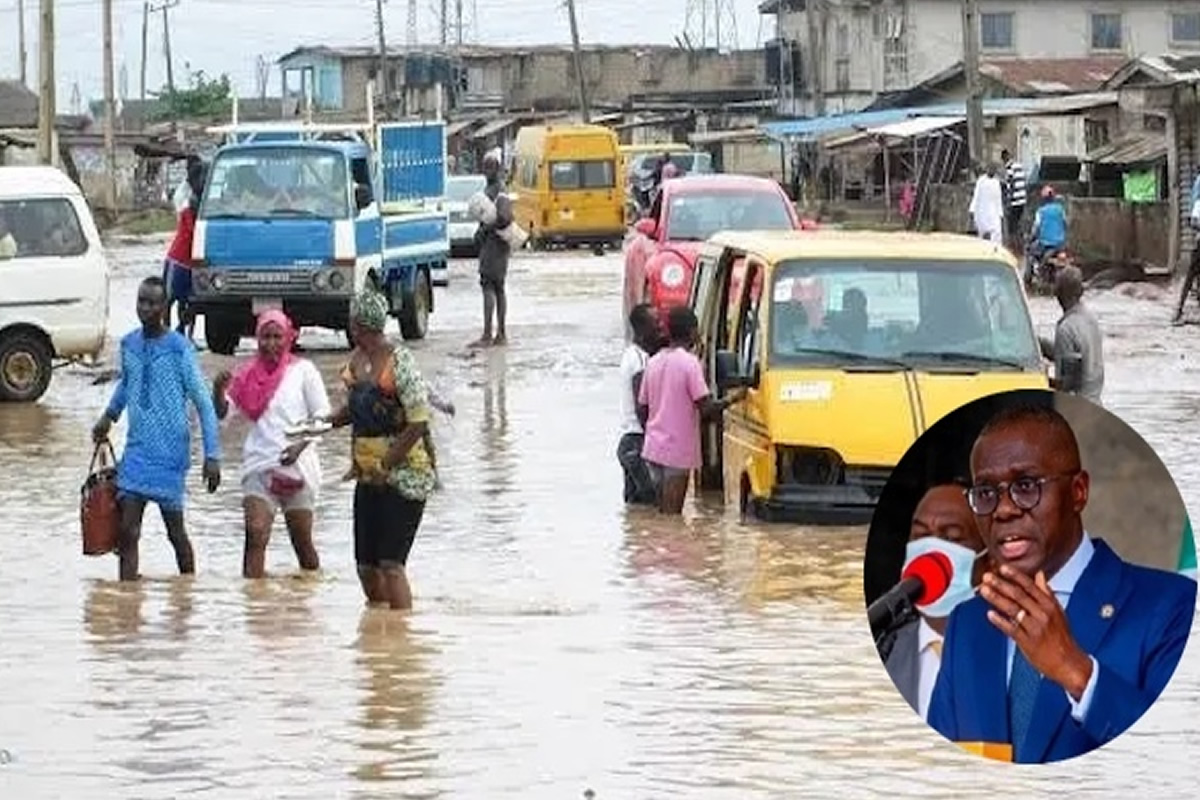 People wading in knee-deep floodwater on a flooded street with submerged cars; circular inset shows a man in a suit speaking at a podium.