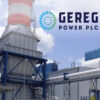 Industrial power plant with cooling towers and Geregu Power PLC logo in the sky above. We see blue steel frameworks and piping.