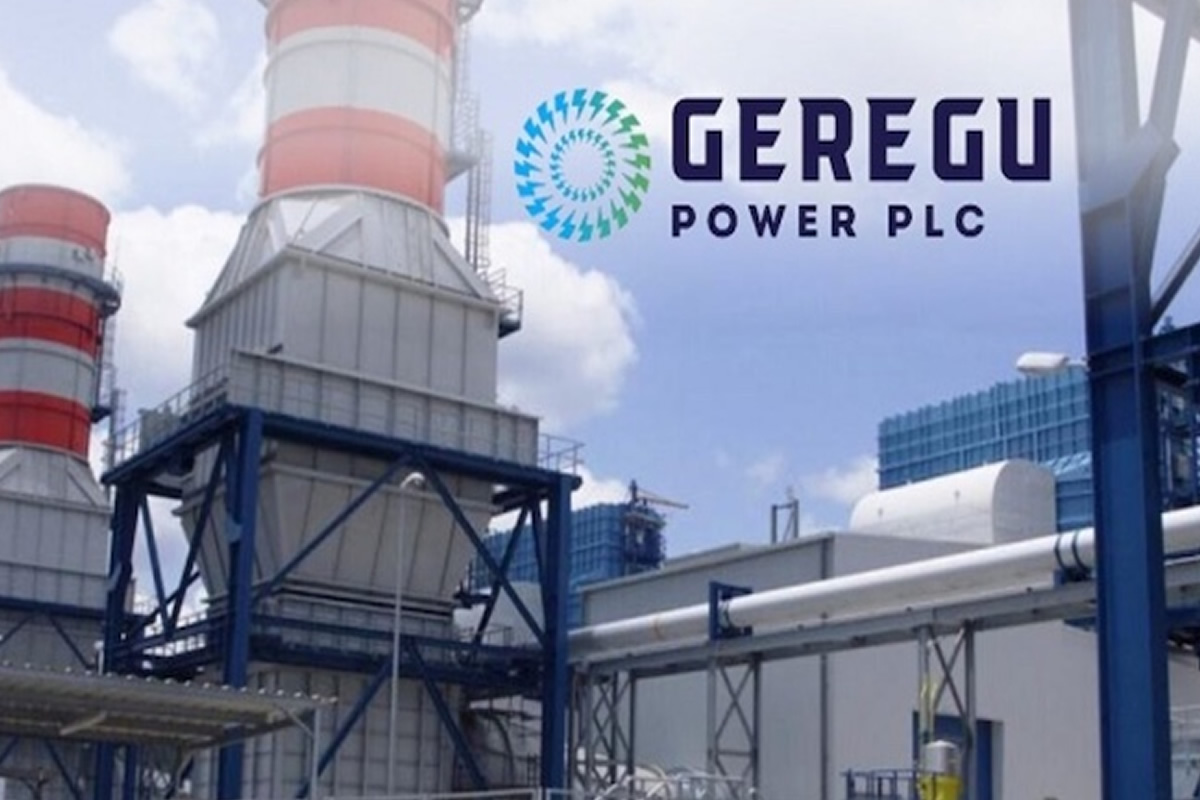 Industrial power plant with cooling towers and Geregu Power PLC logo in the sky above. We see blue steel frameworks and piping.