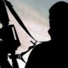 Silhouette of a person holding a rifle on their shoulder, facing left, against a cloudy sky.