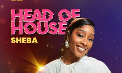 Head of House poster featuring Sheba, smiling woman in white against a purple background.