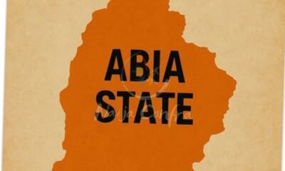 Orange silhouette of Abia State with the label ABIA STATE over it on a beige background
