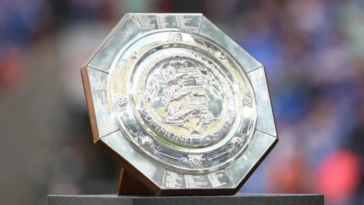Polished silver octagonal trophy on a dark base, featuring a detailed circular center with engravings and a dragon emblem, awarded at a competition.