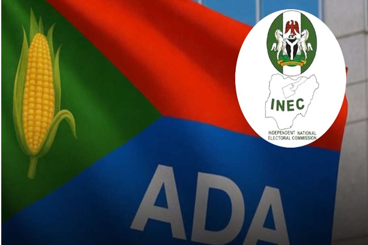 Campaign sign featuring the letters 'ADA' on a blue panel with a corn icon on the left and an INEC emblem overlay on the right.