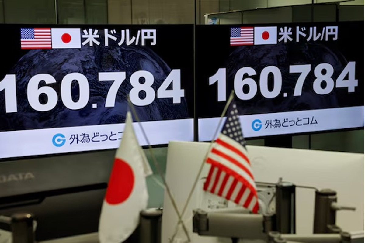 Two large screens show the USD/JPY exchange rate with US and Japan flags, foregrounded by desk flags (US and Japan).